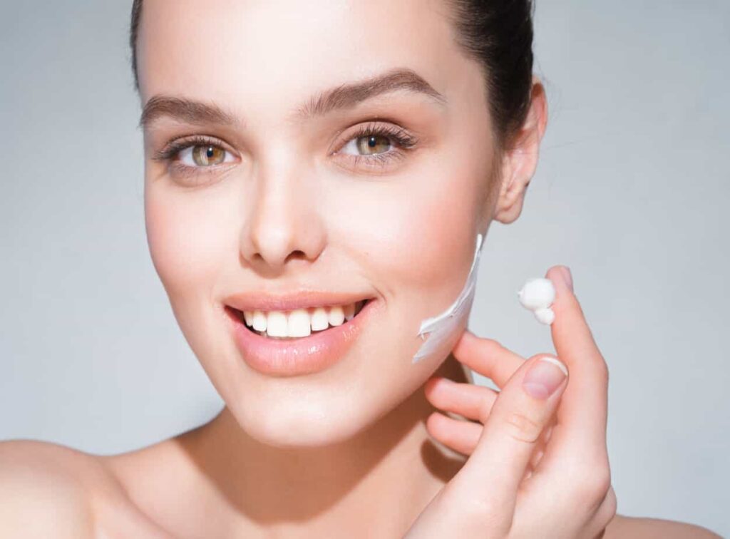 woman-applying-anti-aging-face-cream