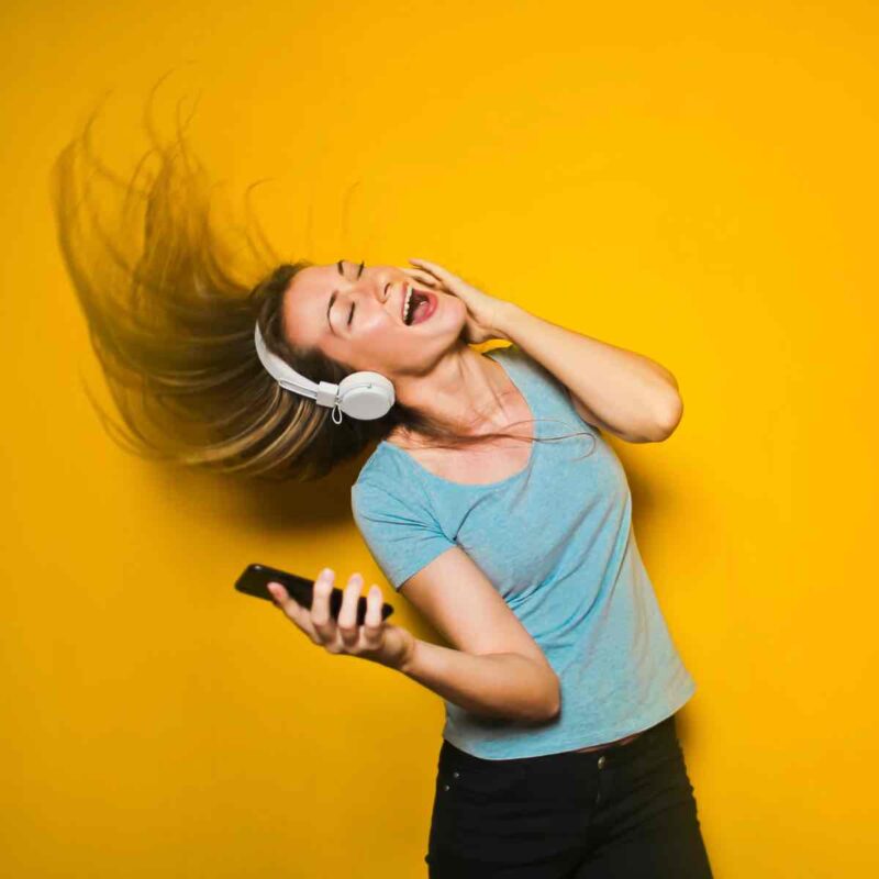 a girl is listening music